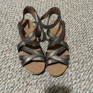 Dansko metallic leather sandals size 11. Velcro fasteners at ankle. Never worn.